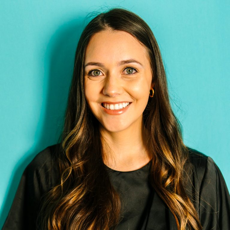 melanie.headshot.aqua_-scaled-2